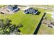 New construction features a modern house and large landscaped yard at 14080 Sydney Rd, Dover, FL 33527