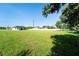 New construction features a modern house and a large landscaped yard at 14080 Sydney Rd, Dover, FL 33527