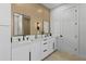 Stylish bathroom with dual sinks, marble countertops, and modern fixtures at 1500 49Th N St, St Petersburg, FL 33710