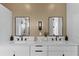 Luxurious bathroom with double sinks, marble countertops, and wood paneling at 1500 49Th N St, St Petersburg, FL 33710