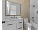 Modern bathroom with a single sink vanity and glass enclosed shower at 1500 49Th N St, St Petersburg, FL 33710