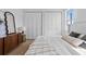 Well-lit bedroom featuring hardwood floors, a comfortable bed, and stylish decor at 1500 49Th N St, St Petersburg, FL 33710
