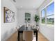 Bright dining room with modern decor, large windows and natural light, offering ample space for gatherings at 1500 49Th N St, St Petersburg, FL 33710