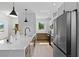 Bright and spacious modern kitchen, featuring stainless steel appliances, sleek cabinets, and hardwood floors at 1500 49Th N St, St Petersburg, FL 33710