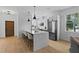 Modern kitchen boasts a center island with bar stools, stainless appliances, and an open layout at 1500 49Th N St, St Petersburg, FL 33710