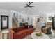 Open concept living area with staircase, modern lighting, and hardwood floors at 1500 49Th N St, St Petersburg, FL 33710