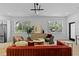 Bright living room featuring hardwood floors, neutral tones, and large windows at 1500 49Th N St, St Petersburg, FL 33710