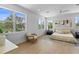 Large, airy main bedroom featuring hardwood floors and multiple windows at 1500 49Th N St, St Petersburg, FL 33710