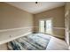 Comfortable bedroom features neutral paint, hardwood floors, and closet space at 16006 Armistead Ln, Odessa, FL 33556
