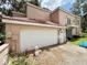 Spacious garage offering ample parking and storage space, ensuring convenience for homeowners at 16006 Armistead Ln, Odessa, FL 33556