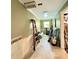 Hallway undergoing renovation with ladders and unfinished trim work at 16006 Armistead Ln, Odessa, FL 33556