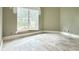 Renovation ready room with large window and light green colored walls at 16006 Armistead Ln, Odessa, FL 33556
