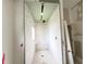 Bathroom featuring new wall tiles with a small window providing natural light at 16006 Armistead Ln, Odessa, FL 33556