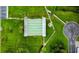 Aerial view of the shuffleboard court and surrounding green spaces in the community at 1701 Pinehurst Rd # 33E, Dunedin, FL 34698