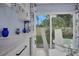 Stylish dining area with modern table, chairs, and a view of the outdoor garden at 1701 Pinehurst Rd # 33E, Dunedin, FL 34698