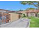 The property features covered parking adjacent to the front of the house with a charming terracotta tile roof at 1701 Pinehurst Rd # 33E, Dunedin, FL 34698