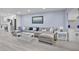 Comfortable living room seamlessly connecting to a modern kitchen and dining area at 1701 Pinehurst Rd # 33E, Dunedin, FL 34698