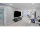 Bright living room with modern decor, flowing seamlessly into the kitchen and dining area at 1701 Pinehurst Rd # 33E, Dunedin, FL 34698