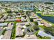 Stunning aerial view of a community with serene ponds and well-manicured landscaping at 1717 Atrium Dr, Sun City Center, FL 33573