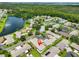 Gorgeous aerial view of a community near a lake, surrounded by beautiful trees at 1717 Atrium Dr, Sun City Center, FL 33573