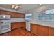 Kitchen showcasing wood cabinetry and stainless steel appliances at 1717 Atrium Dr, Sun City Center, FL 33573