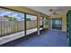 Relaxing screened lanai with a ceiling fan, offering a peaceful outdoor retreat at 1717 Atrium Dr, Sun City Center, FL 33573