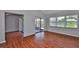 Spacious living room features hardwood floors, sliding glass doors, and a ceiling fan at 1717 Atrium Dr, Sun City Center, FL 33573