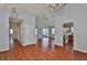Open living area with vaulted ceilings, sliding doors to the patio, and seamlessly connected kitchen at 1717 Atrium Dr, Sun City Center, FL 33573