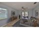 Cozy bedroom with a ceiling fan, sliding glass doors to the patio, and neutral decor at 1717 Atrium Dr, Sun City Center, FL 33573