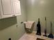 Functional laundry room equipped with upper cabinets and a utility sink at 1813 Laurel Oak Dr, Valrico, FL 33596