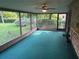 Enclosed sunroom with green carpet and screen windows at 1813 Laurel Oak Dr, Valrico, FL 33596