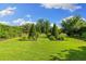 Manicured backyard with green lawn and manicured landscaping at 18521 Wayne Rd, Odessa, FL 33556
