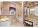 Bathroom with bathtub and vanity and mirrors at 18521 Wayne Rd, Odessa, FL 33556
