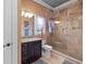 Bathroom featuring a glass shower enclosure and granite vanity at 18521 Wayne Rd, Odessa, FL 33556