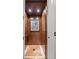 Private residential elevator with wood paneling and tile floors at 18521 Wayne Rd, Odessa, FL 33556