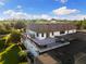 Expansive home boasts a spacious rooftop deck with outdoor seating and black metal railings, perfect for entertaining at 18521 Wayne Rd, Odessa, FL 33556