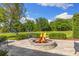 Stone fire pit with seating area, perfect for outdoor gatherings at 18521 Wayne Rd, Odessa, FL 33556