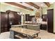 Gourmet kitchen with a large island, stylish cabinetry, and stainless appliances at 18521 Wayne Rd, Odessa, FL 33556