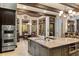 Spacious kitchen includes a central island with seating, dining nook and views at 18521 Wayne Rd, Odessa, FL 33556