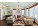Charming living room with fireplace, piano, and lots of natural light at 18521 Wayne Rd, Odessa, FL 33556