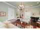 Cozy living room with high ceilings, fireplace, and dark wood flooring at 18521 Wayne Rd, Odessa, FL 33556