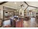 Open-concept living room featuring a bar, billiards and multiple seating areas at 18521 Wayne Rd, Odessa, FL 33556
