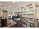 Second floor loft with hardwood floors, a coffered ceiling and desk areas at 18521 Wayne Rd, Odessa, FL 33556