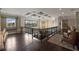 Second floor loft with hardwood floors, a coffered ceiling and large windows at 18521 Wayne Rd, Odessa, FL 33556
