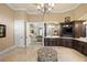 Lavish bathroom featuring dual vanities, marble floors, and custom cabinetry at 18521 Wayne Rd, Odessa, FL 33556