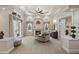 Spacious main bedroom featuring a fireplace, seating area, and elegant decor at 18521 Wayne Rd, Odessa, FL 33556