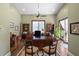 Home office with wood floors, built-in shelves, and a large desk at 18521 Wayne Rd, Odessa, FL 33556