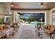 A spacious outdoor living area provides ample seating with views of the custom pool area at 18521 Wayne Rd, Odessa, FL 33556