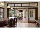 Outdoor patio with dining area, fireplace, television and view of the pool and outdoors at 18521 Wayne Rd, Odessa, FL 33556