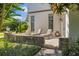 Stone patio with lounge chairs outside this beautiful home at 18521 Wayne Rd, Odessa, FL 33556
